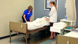 CNA Skill Making an Occupied Bed  Changing Linens [upl. by Altman]